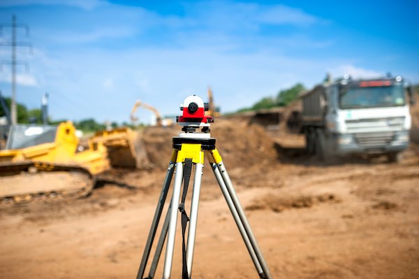 Surveyor equipment optical level or theodolite at construction site