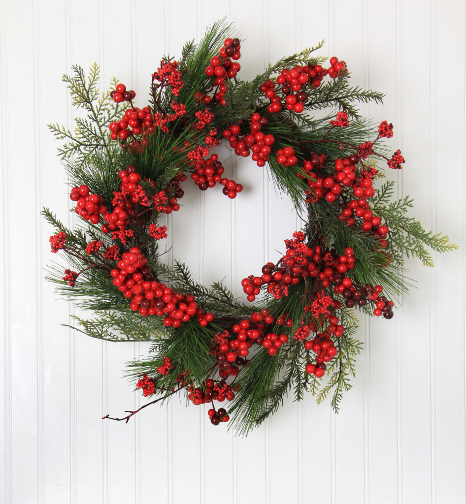 Christmas wreath of berries and evergreen.